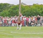 image of tossing
                                                  the caber